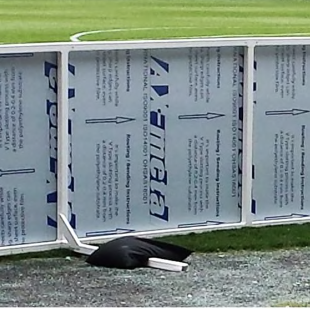 Behind Sign